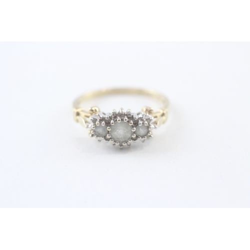 104 - 9ct gold aquamarine three stone ring with diamond surround (3.6g) - AS SEEN - MISHAPEN Size  U