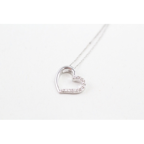 114 - 9ct white gold heart pendant with9ct white gold chain (1.3g)