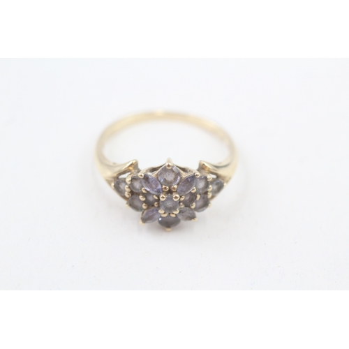 153 - 9ct gold tanzanite floral cluster ring (2.9g) Size  T