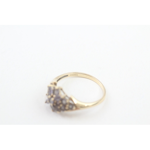 153 - 9ct gold tanzanite floral cluster ring (2.9g) Size  T