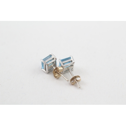 154 - 9ct gold square cut blue topaz stud earrings (1g)