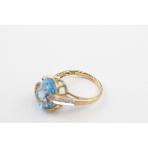 155 - 9ct gold blue topaz & diamond dress ring with butterfly mount (5.5g) Size  O