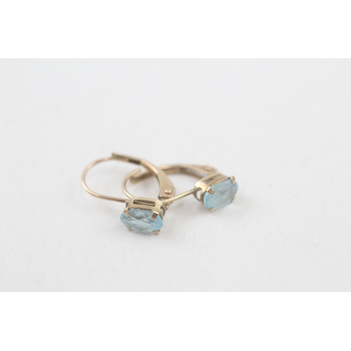 157 - 9ct gold oval cut blue topaz drop earrings (0.7g)