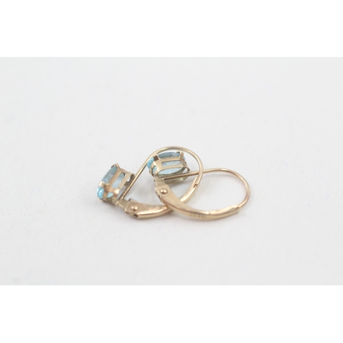 157 - 9ct gold oval cut blue topaz drop earrings (0.7g)