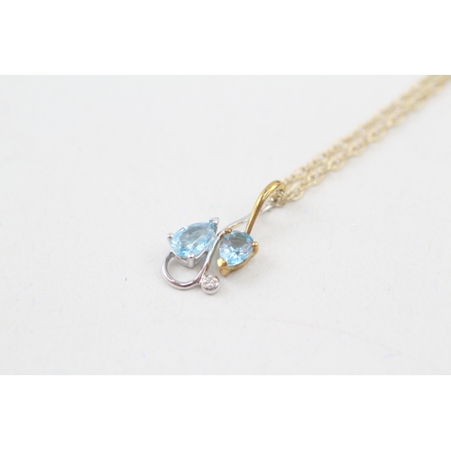 158 - 9ct gold pear cut blue topaz & diamond pendant necklace (2.4g)