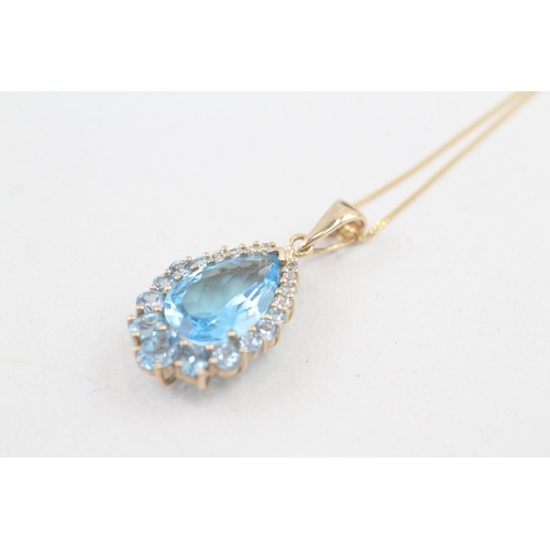 163 - 9ct gold blue topaz pendant necklace (4.1g)