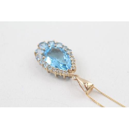 163 - 9ct gold blue topaz pendant necklace (4.1g)