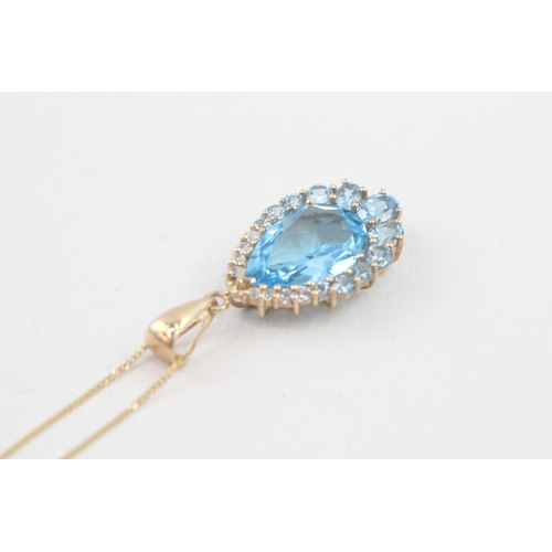 163 - 9ct gold blue topaz pendant necklace (4.1g)