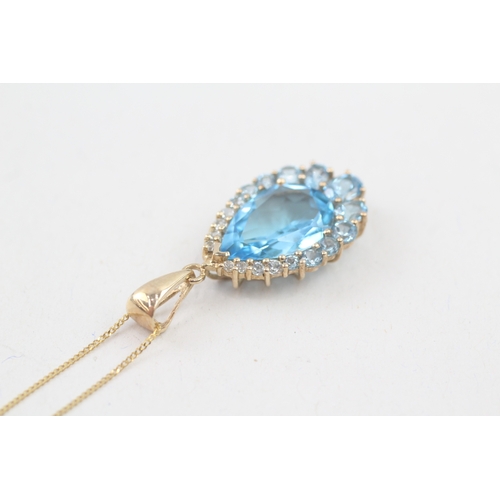 163 - 9ct gold blue topaz pendant necklace (4.1g)