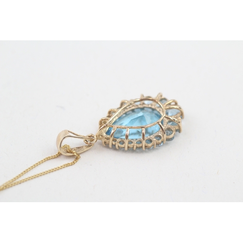 163 - 9ct gold blue topaz pendant necklace (4.1g)