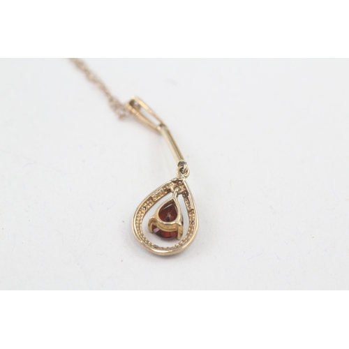 186 - 9ct gold pear cut garnet & diamond drop necklace (2.1g)