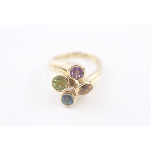 193 - 9ct gold multi-gemstone dress ring, gemstone including: peridot, amethyst, blue topaz & citrine (4.5... 