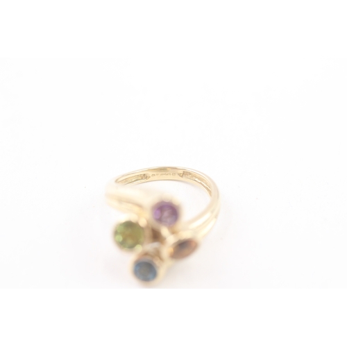 193 - 9ct gold multi-gemstone dress ring, gemstone including: peridot, amethyst, blue topaz & citrine (4.5... 