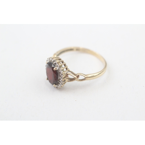 208 - 9ct gold diamond & garnet oval halo ring (2.3g) Size  P