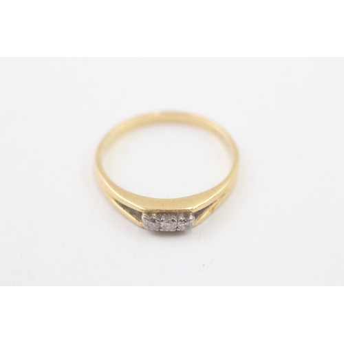 211 - 18ct gold diamond three stone ring (2.3g) Size  P