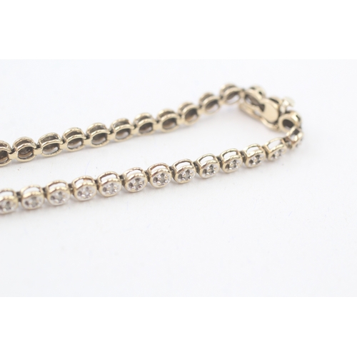 212 - 9ct gold diamond round tennis link bracelet (6.6g)