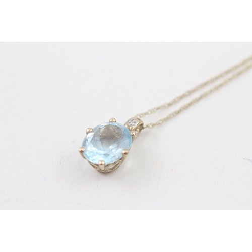 22 - 9ct gold blue topaz & diamond pendant necklace with a heart shape gallery (2.8g)