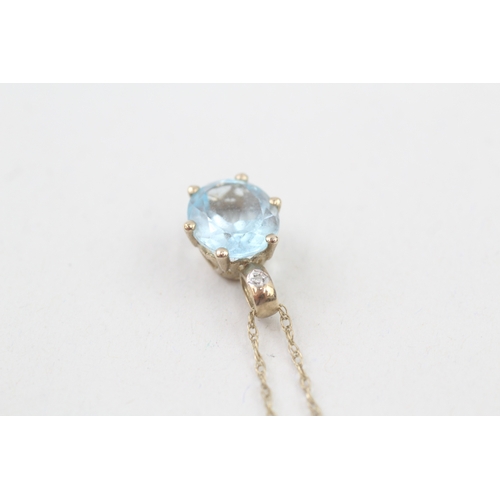 22 - 9ct gold blue topaz & diamond pendant necklace with a heart shape gallery (2.8g)