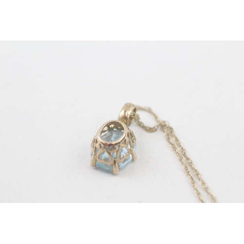 22 - 9ct gold blue topaz & diamond pendant necklace with a heart shape gallery (2.8g)