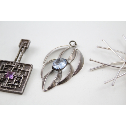 243 - Four silver modernist pendants including Blue John