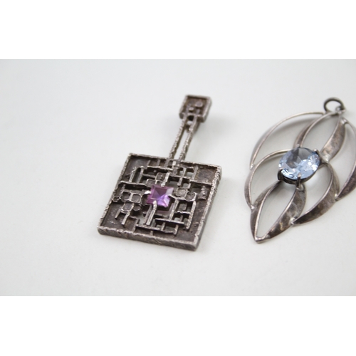 243 - Four silver modernist pendants including Blue John