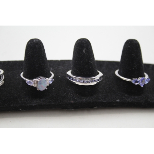 244 - A collection of silver gemstone rings including Opal doublet