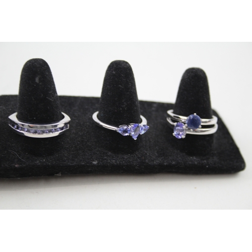 244 - A collection of silver gemstone rings including Opal doublet