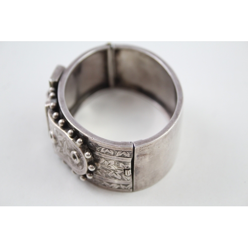 245 - Silver antique bangle with buckle detail