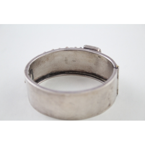 245 - Silver antique bangle with buckle detail