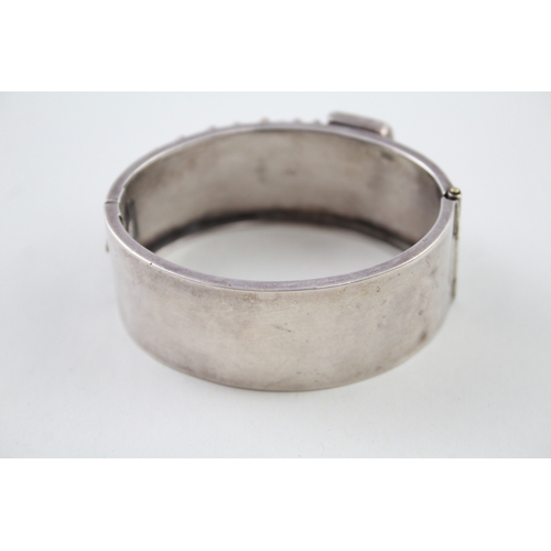 245 - Silver antique bangle with buckle detail