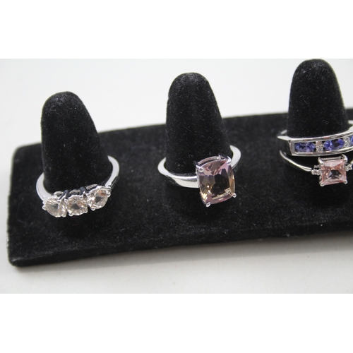 259 - A collection of silver gemstone rings including Ametrine