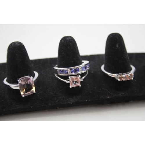 259 - A collection of silver gemstone rings including Ametrine