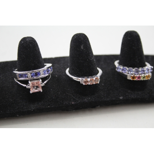 259 - A collection of silver gemstone rings including Ametrine