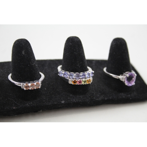 259 - A collection of silver gemstone rings including Ametrine