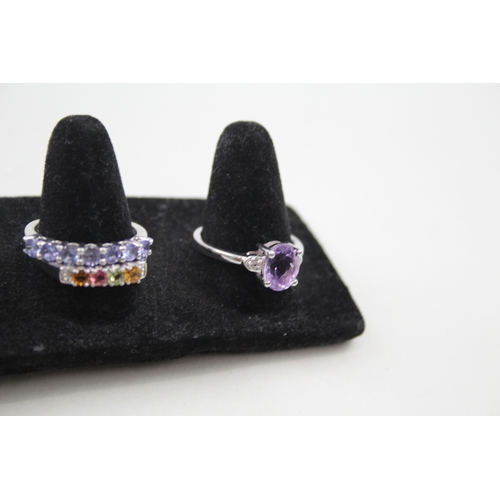 259 - A collection of silver gemstone rings including Ametrine