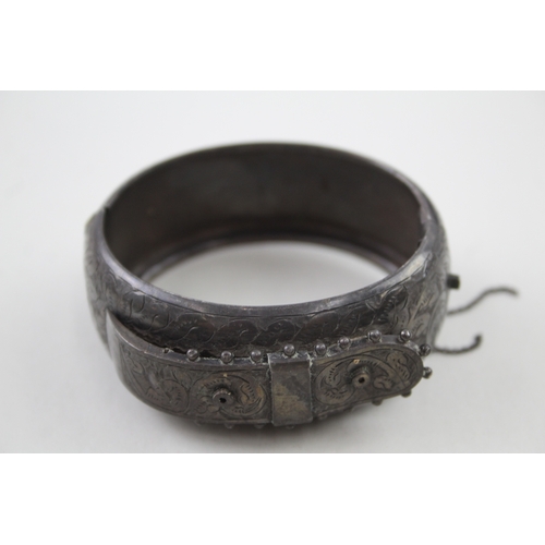 268 - Silver antique bangle with buckle design