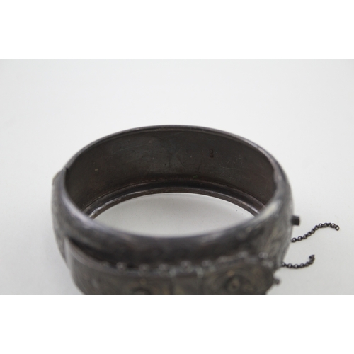 268 - Silver antique bangle with buckle design