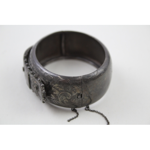 268 - Silver antique bangle with buckle design