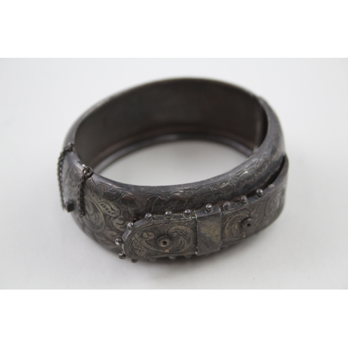 268 - Silver antique bangle with buckle design