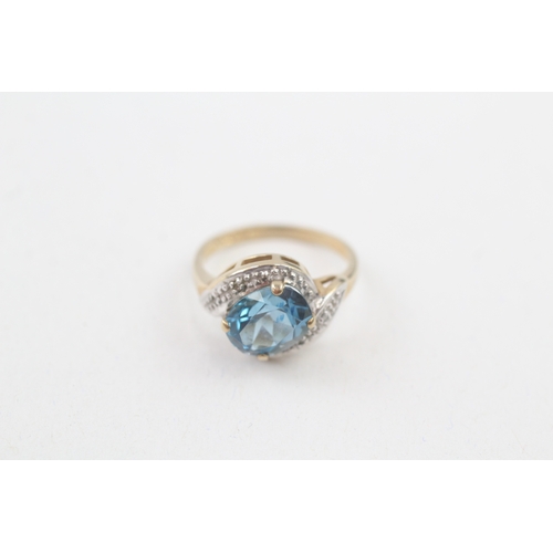 27 - 9ct gold blue topaz & diamond dress ring (2.3g) Size  I 1/2