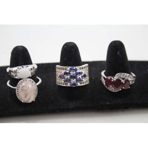 274 - A collection of silver gemstone rings including Opal