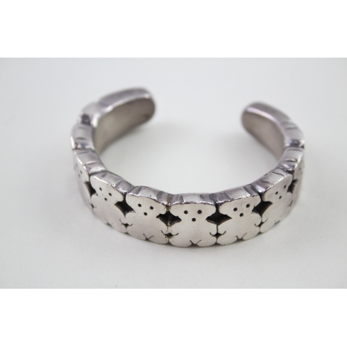 276 - Silver bangle with teddy bear design