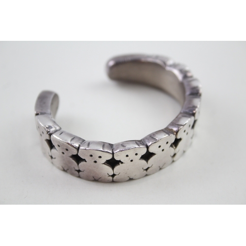 276 - Silver bangle with teddy bear design