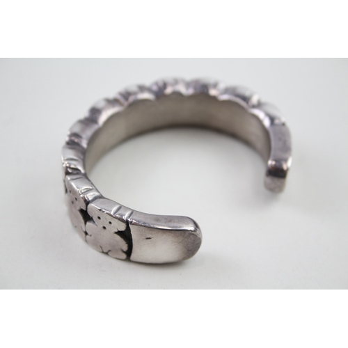 276 - Silver bangle with teddy bear design