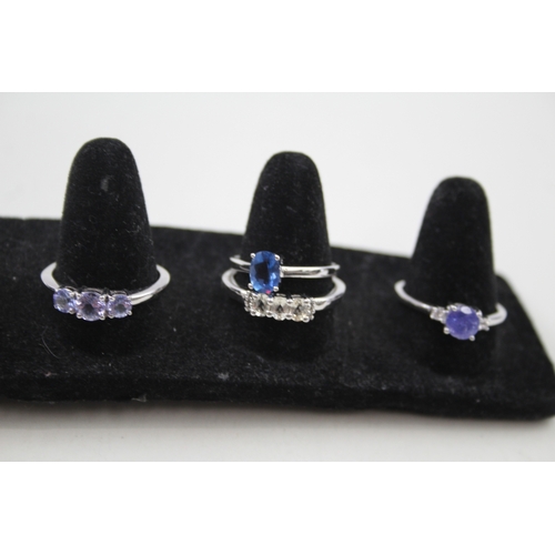 284 - A collection of silver gemstone rings including Topaz