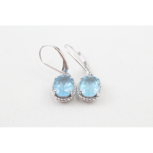 44 - 9ct white gold blue topaz drop earrings with hinged hooks (2.7g)