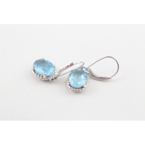 44 - 9ct white gold blue topaz drop earrings with hinged hooks (2.7g)