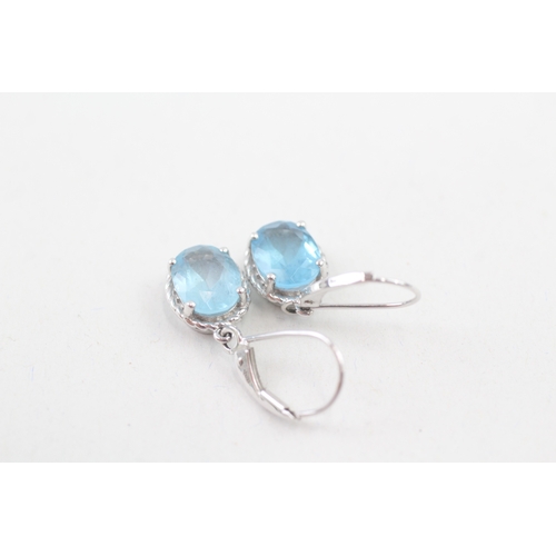 44 - 9ct white gold blue topaz drop earrings with hinged hooks (2.7g)