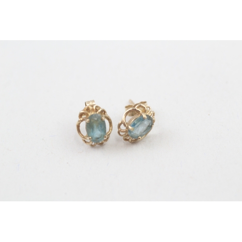 48 - 9ct gold blue topaz stud earrings (1g)