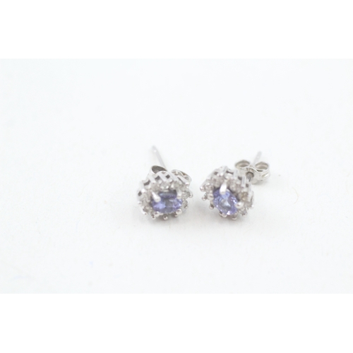 5 - 9ct white gold tanzanite and diamond halo stud earrings (1.2g)